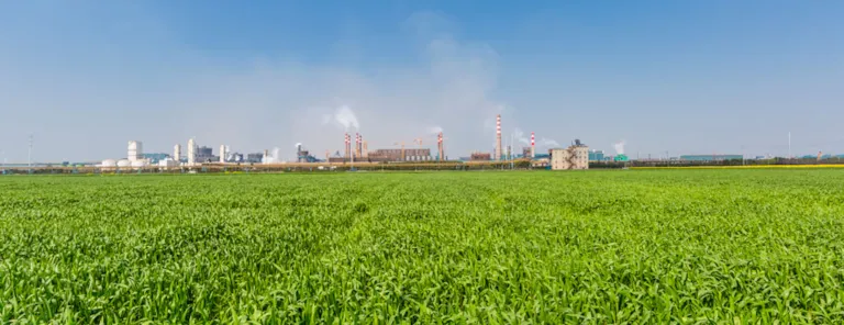 Industrial zone - surrounded by green gras and blue sky