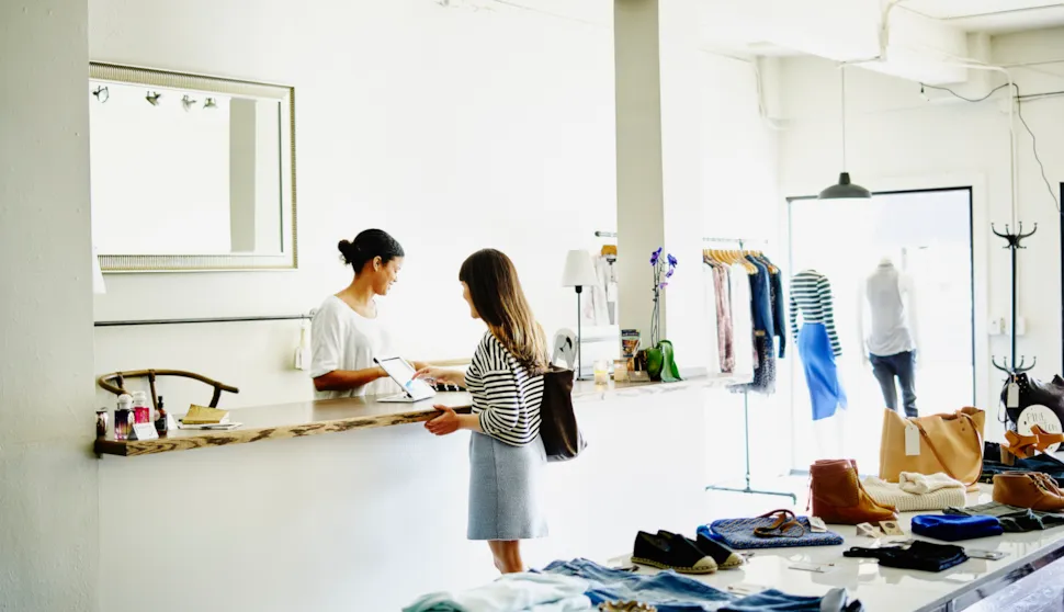 Customer completing transaction on digital tablet