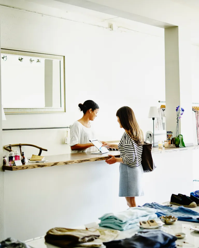 Customer completing transaction on digital tablet