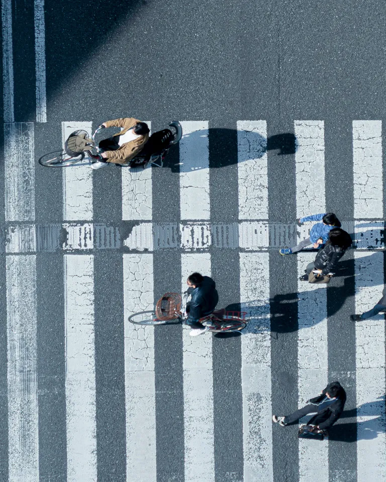 Aerial view of people crossing the road